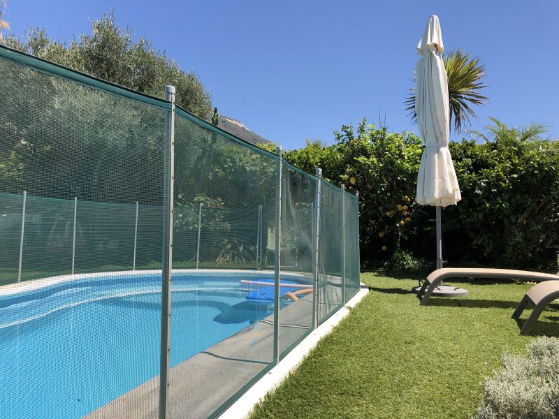 Removable Mesh Fence Secured Around Pool